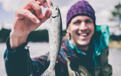 A fishing reel is a cylindrical device attached to a fishing